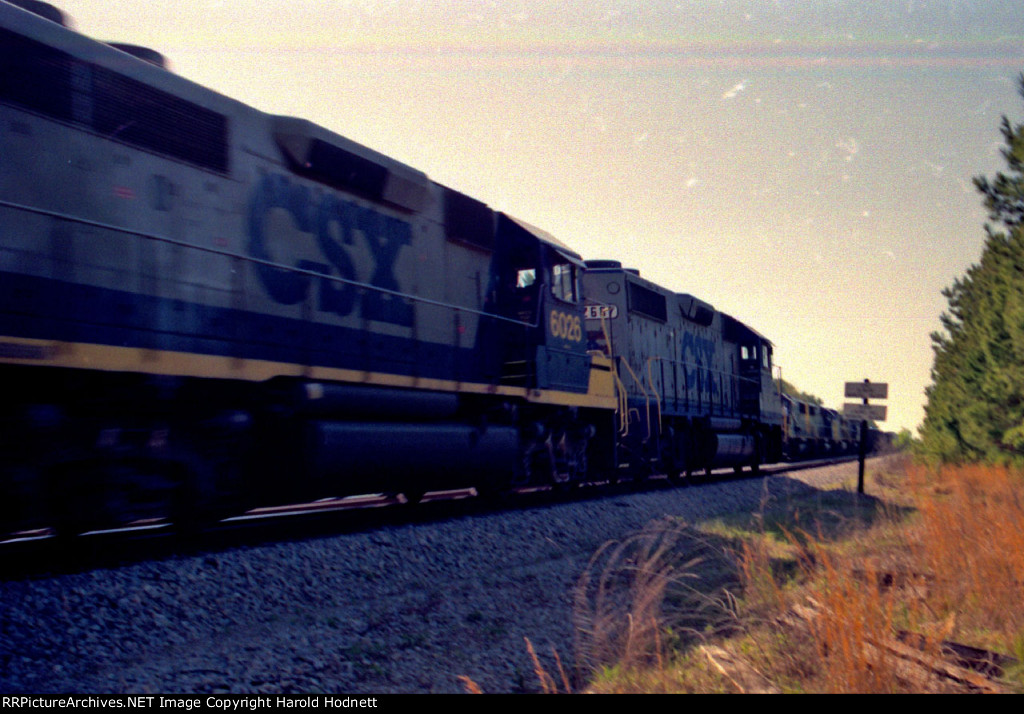 CSX 2687 leads its train past a waiting train